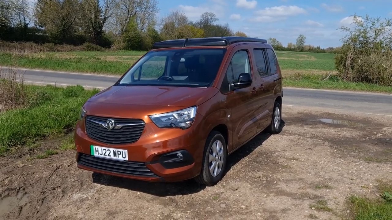 The Vikenze III-e electric campervan with roof down, showing the solar panel