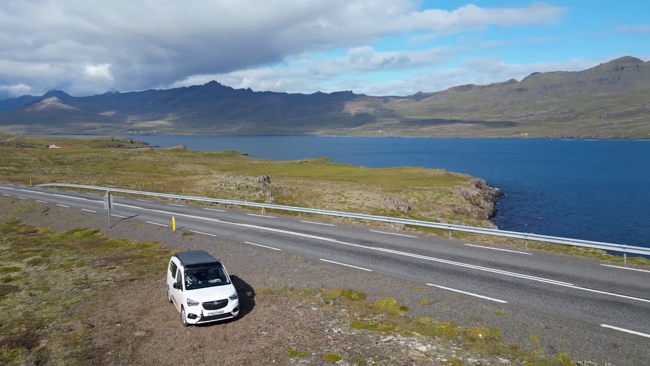 The Vikenze III-e XL parked at a geothermal area with steam rising from the earth
