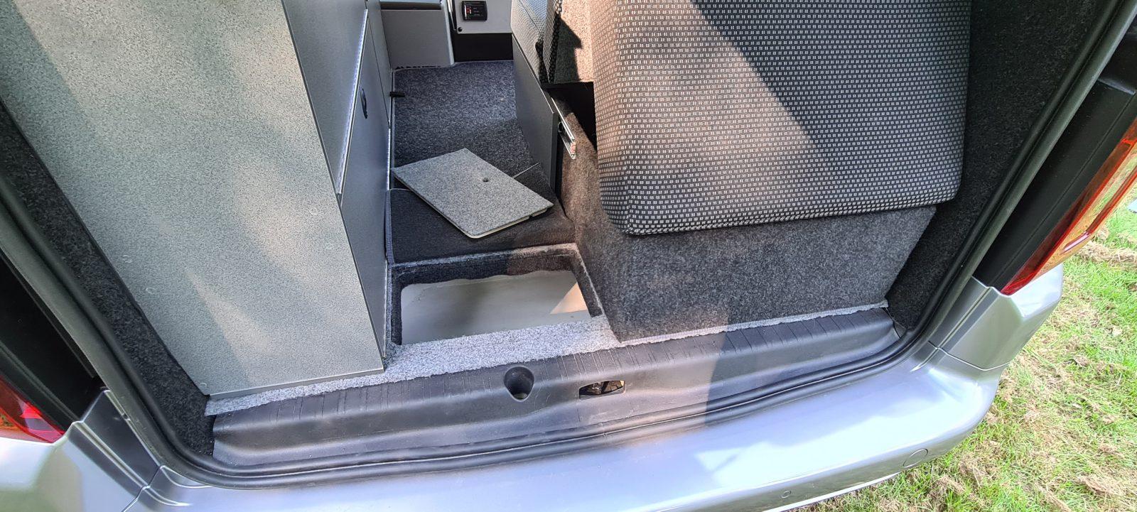 Vikenze III-e interior with fold-flat bed and power sockets