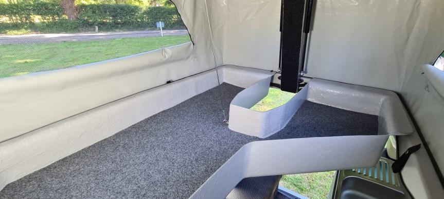 Vikenze III-e rear storage with Porta Potti and water container