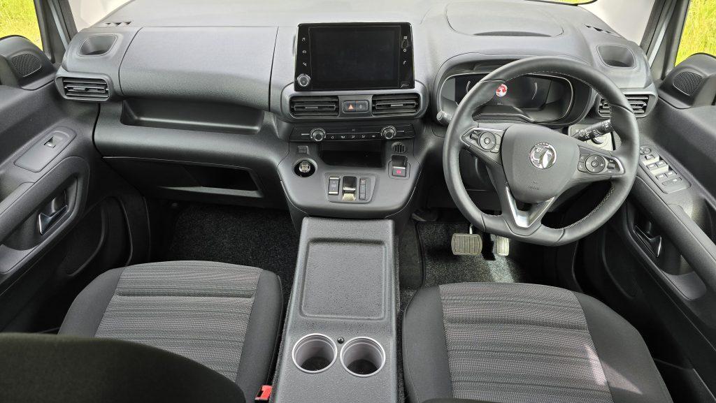 Vikenze II camper car cab dashboard close-up with touchscreen display, climate controls and steering wheel